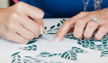 woman crafting, cutting paper 