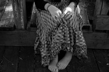 teen girl sitting with bare feet 