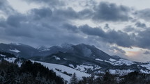 Fast clouds over winter mountains time lapse

