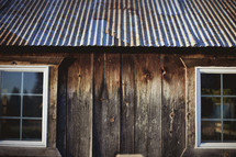 An old cabin with a tin roof 