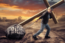 Man tries to carry both a cross and his pride.
