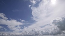 Wedge planes fly on the background of the sky Air plane flies in the blue sky above the clouds