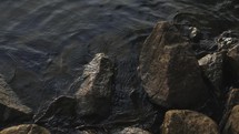 water lapping over rocks 