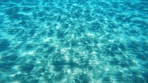 Underwater light background on the sea floor