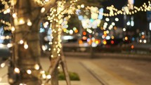 Christmas lights decorating a city street at night