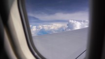 Sunset and Journey from the Airplane Window. Plane Flights Over Fluffy Clouds. Passenger window panorama view.