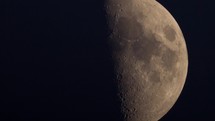 Close up of the moon in half phase