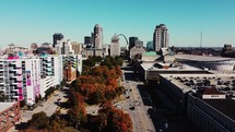 Aerial view of downtown Saint Louis, Missouri with buildings and trees in the fall time.