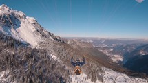 Paragliding flying in winter alpine mountains, Beauty freedom of free flight adrenaline adventure in snowy nature landscape 