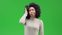 Woman on green screen scratching her head acting confused