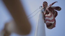 raising an American flag on a flagpole 