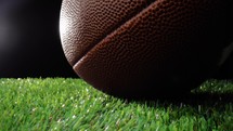 Close up of a football ball on the grass