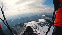 Paragliding adrenaline adventure flight over winter forest mountains nature, fly high freedom extreme sport
