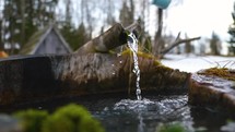 Slow motion of crystal drinking water flow in the spring well
