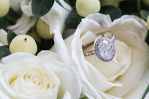diamond ring on white roses 