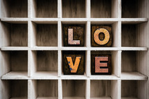 word love on a wood shelf 