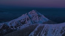Sunrise over majestic alps mountain peak in frozen winter nature landscape in colorful dawn morning Time lapse
