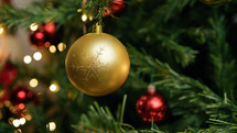 Christmas golden ball on the tree