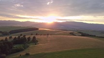 Golden sunset in rural landscape Aerial panoramic view
