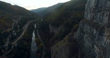 aerial view over river and steep cliffs 