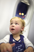 Young passenger in the plane