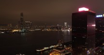 Night illumination flight over hong kong city downtown. 