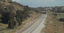 Passenger train traveling on the tracks at high speed.