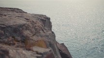 rocky cliffs along a shore 