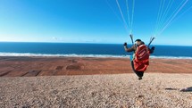 Paragliding pilot take off his flight in Morocco mountains and swing and play in the wind in Summer Adrenaline Freedom Adventure
