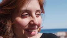 Woman Smiles Overlooking Her City From Above