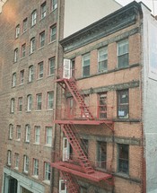 fire escape steps on a brick apartment building 