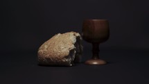 spinning wooden chalice and bread loaf 