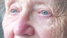 blinking eyes of an elderly woman 