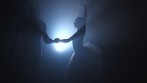 Silhouette of professional ballet dancers on dark stage