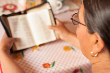 a woman reading a Bible 