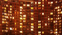 day to night time-lapse of an apartment building