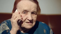 Elderly woman talking on the cell phone