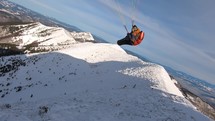 Extreme flying and swing on paragliding wing in winter mountains adrenaline adventure

