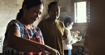 Women prepare food in the Church