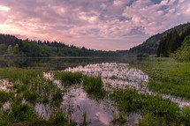 lake at sunrise and marsh 