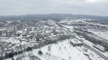 aerial view over a snow covered community 