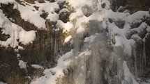 Frozen waterfall stream in cold winter