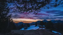 Time lapse of colorful sunrise sky under tree in spring nature mountains travel background panorama