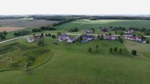 Aerial of large houses in a rural neighborhood