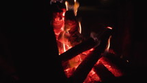 Close up panning shot of bonfire.