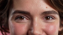 Half face with eyes, brows, nose. Pretty kind woman, natural beauty. Close-up charming brown eyes. High quality 4k footage