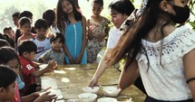 Serving children food in the Philippines