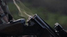 Smoke from the trunks of smooth-bore hunting rifle