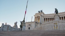 Italian Flag and the glory of Rome monuments 