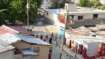 activity in a dirt road alleyway in Haiti 